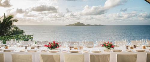 A dining setting overlooking the ocean at Kokomo Private Island Fiji